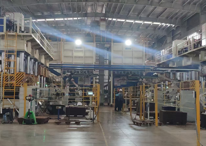 工厂车间内部，多台大型机械设备整齐排列，工人正在操作检测设备